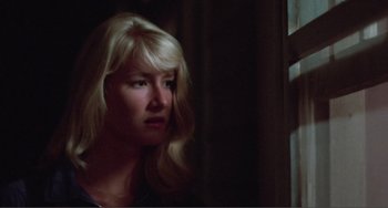 Movie still from “Smooth Talk” (1985), directed by Joyce Chopra – A woman with blonde hair looking out a window; Close Up shot, Low angle