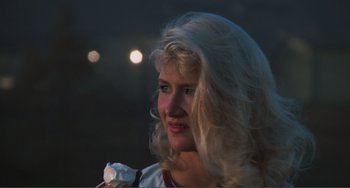 Movie still from “Smooth Talk” (1985), directed by Joyce Chopra – A woman with blonde hair is looking at the camera; Close Up shot, Over the shoulder angle
