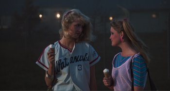 Movie still from “Smooth Talk” (1985), directed by Joyce Chopra – Two women are eating ice - cream while standing outside; Medium shot, Over the shoulder angle