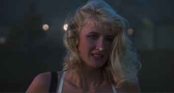 Movie still from “Smooth Talk” (1985), directed by Joyce Chopra – A woman with blonde hair and a white shirt; Close Up shot, Low angle