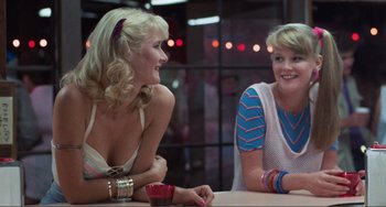 Movie still from “Smooth Talk” (1985), directed by Joyce Chopra – Two women sitting at a table talking to each other; Medium shot, Over the shoulder angle
