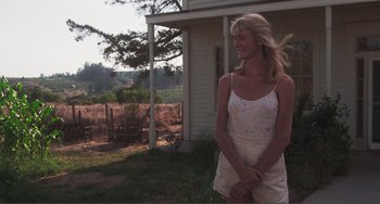 Movie still from “Smooth Talk” (1985), directed by Joyce Chopra – A woman standing in front of a house; Medium shot, Low angle
