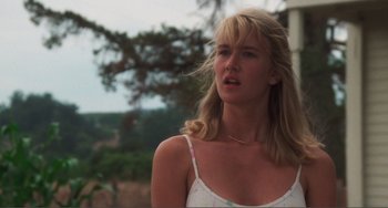 Movie still from “Smooth Talk” (1985), directed by Joyce Chopra – A woman with blonde hair is standing in front of a tree; Close Up shot, Low angle