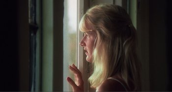 Movie still from “Smooth Talk” (1985), directed by Joyce Chopra – A woman is looking out of a window; Close Up shot, Low angle
