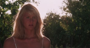 Movie still from “Smooth Talk” (1985), directed by Joyce Chopra – A woman with blonde long hair and a white top; Close Up shot, Low angle