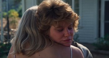 Movie still from “Smooth Talk” (1985), directed by Joyce Chopra – A young woman with blonde hair is looking down at her face; Close Up shot, Over the shoulder angle