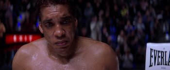 Movie still from “Snake Eyes” (1998), directed by Brian De Palma – A person with a body of water on his chest; Close Up shot, Low angle