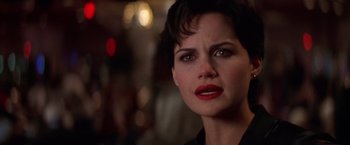 Movie still from “Snake Eyes” (1998), directed by Brian De Palma – A woman that is looking at the camera; Close Up shot, Over the shoulder angle