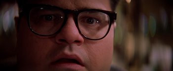 Movie still from “Snake Eyes” (1998), directed by Brian De Palma – A person wearing glasses; Extreme Close Up shot, Low angle