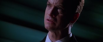 Movie still from “Snake Eyes” (1998), directed by Brian De Palma – A man that is looking at something in the dark; Close Up shot, Low angle