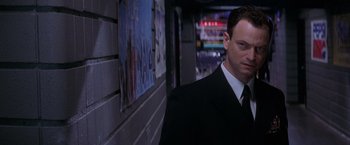 Movie still from “Snake Eyes” (1998), directed by Brian De Palma – A man in a suit and tie; Close Up shot, Low angle