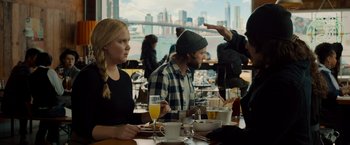 Movie still from “Snatched” (2017), directed by Jonathan Levine – A group of people sitting at a table with food; Medium shot, Over the shoulder angle