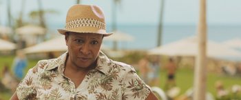 Movie still from “Snatched” (2017), directed by Jonathan Levine – A woman wearing a straw hat standing in front of the ocean; Close Up shot, Over the shoulder angle