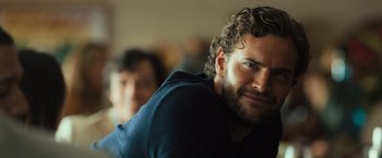 Movie still from “Snatched” (2017), directed by Jonathan Levine – A person with curly hair and a beard; Close Up shot, Over the shoulder angle