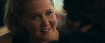 Movie still from “Snatched” (2017), directed by Jonathan Levine – A woman smiling for the camera; Close Up shot, Over the shoulder angle