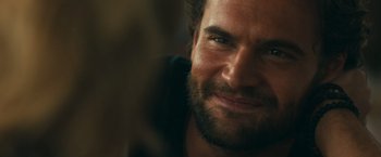 Movie still from “Snatched” (2017), directed by Jonathan Levine – Close up of a man with a beard looking at the camera; Close Up shot, Over the shoulder angle