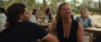 Movie still from “Snatched” (2017), directed by Jonathan Levine – A woman sitting at a table with a glass of wine in front of a man; Medium shot, Over the shoulder angle