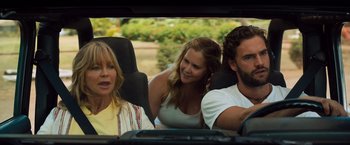 Movie still from “Snatched” (2017), directed by Jonathan Levine – Two women and a man in the back seat of a car; Close Up shot, Over the shoulder angle