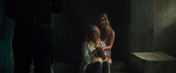 Movie still from “Snatched” (2017), directed by Jonathan Levine – Two women sitting on a bench in the dark; Medium shot, Over the shoulder angle