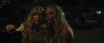 Movie still from “Snatched” (2017), directed by Jonathan Levine – Two women standing next to each other in the dark; Close Up shot, Over the shoulder angle