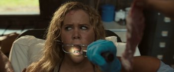 Movie still from “Snatched” (2017), directed by Jonathan Levine – A woman is being examined by a doctor; Close Up shot, Over the shoulder angle