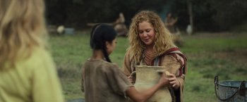Movie still from “Snatched” (2017), directed by Jonathan Levine – A woman is holding a bag while another woman looks on; Medium shot, Over the shoulder angle