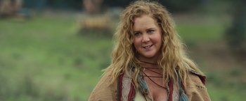 Movie still from “Snatched” (2017), directed by Jonathan Levine – A woman with long blonde hair wearing a brown jacket; Close Up shot, Over the shoulder angle