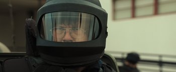 Movie still from “Snatched” (2017), directed by Jonathan Levine – A person wearing a helmet and glasses; Close Up shot, Over the shoulder angle