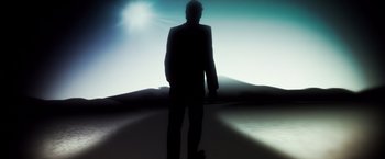 Movie still from “Snowden” (2016), directed by Oliver Stone – A man standing in the middle of the desert; Wide shot, Low angle