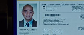 Movie still from “Snowden” (2016), directed by Oliver Stone – An image of an id card of a man; Extreme Close Up shot, Overhead angle