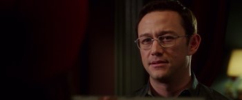 Movie still from “Snowden” (2016), directed by Oliver Stone – A person wearing glasses; Close Up shot, Over the shoulder angle