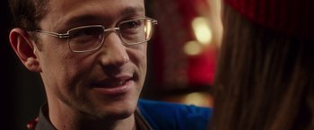 Movie still from “Snowden” (2016), directed by Oliver Stone – A person wearing glasses; Close Up shot, Over the shoulder angle