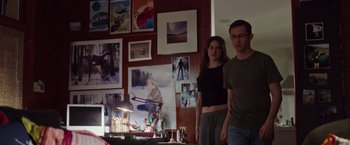 Movie still from “Snowden” (2016), directed by Oliver Stone – A man and a woman standing in front of a desk; Medium shot, Low angle