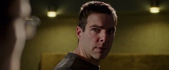 Movie still from “Snowden” (2016), directed by Oliver Stone – A person wearing a brown t - shirt; Close Up shot, Low angle