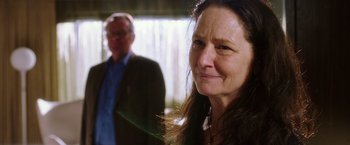 Movie still from “Snowden” (2016), directed by Oliver Stone – A man and a woman standing next to each other; Close Up shot, Over the shoulder angle