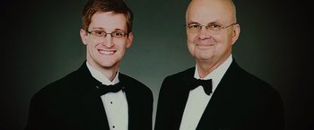 Movie still from “Snowden” (2016), directed by Oliver Stone – Two men in tuxedos posing for a picture; Close Up shot, Overhead angle