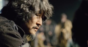 Movie still from “Snowpiercer” (2013), directed by Bong Joon Ho – A man's face in a museum exhibit; Close Up shot, Over the shoulder angle