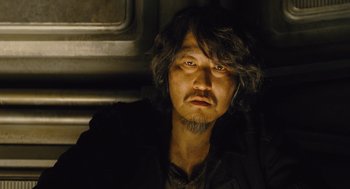 Movie still from “Snowpiercer” (2013), directed by Bong Joon Ho – A person with a beard; Close Up shot, Low angle