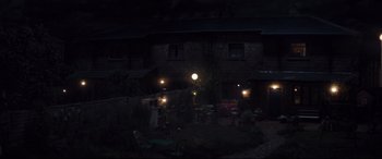 Movie still from “A Monster Calls” (2016), directed by J.A. Bayona – A backyard at night lit up by street lights; Extreme Wide shot, High angle