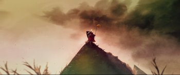 Movie still from “A Monster Calls” (2016), directed by J.A. Bayona – A person standing on top of a hill holding a kite; Extreme Wide shot, Low angle