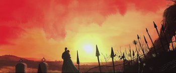Movie still from “A Monster Calls” (2016), directed by J.A. Bayona – A man and a woman standing in front of the setting sun; Extreme Wide shot, Low angle