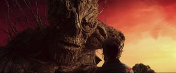 Movie still from “A Monster Calls” (2016), directed by J.A. Bayona – A giant tree that is next to a person; Close Up shot, Low angle