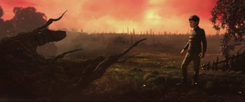 Movie still from “A Monster Calls” (2016), directed by J.A. Bayona – An image of a tree in the middle of a grassy field; Extreme Wide shot, Low angle