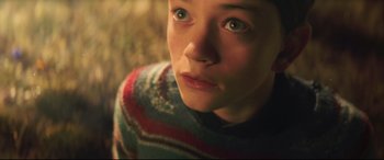 Movie still from “A Monster Calls” (2016), directed by J.A. Bayona – A person wearing a sweater; Close Up shot, High angle