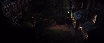 Movie still from “A Monster Calls” (2016), directed by J.A. Bayona – A person standing in a yard at night; Extreme Wide shot, High angle