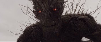 Movie still from “A Monster Calls” (2016), directed by J.A. Bayona – The face of an evil looking creature; Close Up shot, Low angle