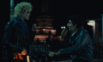 Movie still from “So Long, Stooge” (1983), directed by Claude Berri – A man and a woman are talking on a phone; Medium shot, Over the shoulder angle