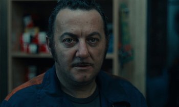 Movie still from “So Long, Stooge” (1983), directed by Claude Berri – A person wearing a jacket; Close Up shot, Low angle