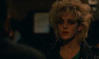 Movie still from “So Long, Stooge” (1983), directed by Claude Berri – A person wearing a leather jacket; Close Up shot, Over the shoulder angle