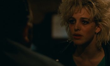 Movie still from “So Long, Stooge” (1983), directed by Claude Berri – A person wearing a jacket; Close Up shot, Over the shoulder angle